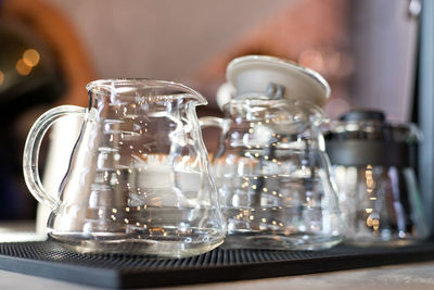 Close-up of jugs on table