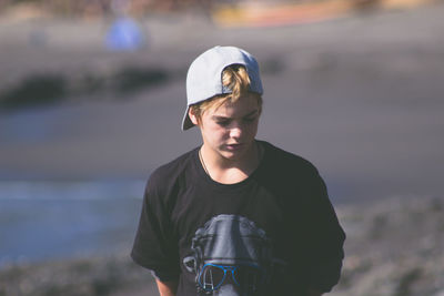 Portrait of young man standing outdoors