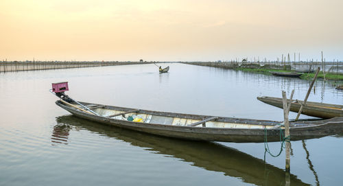 Scenic view of lake against sky during sunset