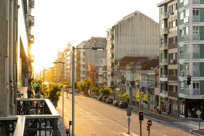 City street and buildings against sky