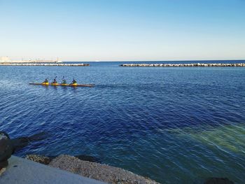 Scenic view of sea against clear blue sky