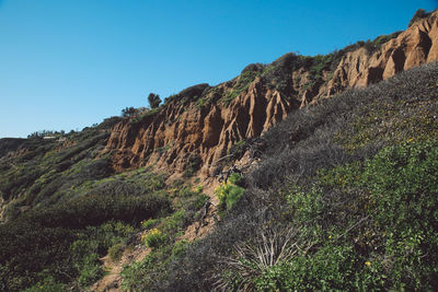 Scenic view of mountains against clear blue sky