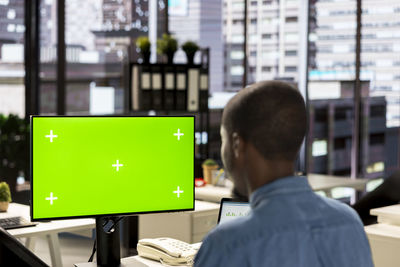 Rear view of man standing in city