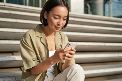 Young woman using mobile phone