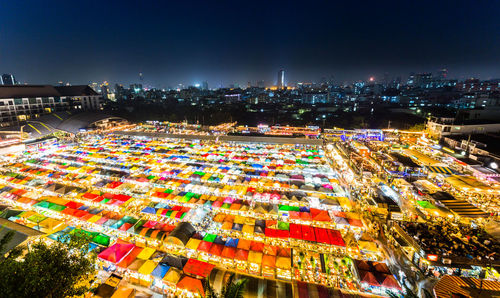 High angle view of illuminated buildings in city at night