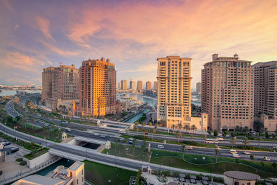 High angle view of buildings against sky during sunset