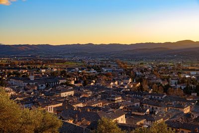 High angle shot of townscape against sky at sunset