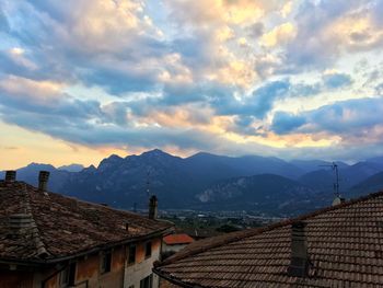 Houses on mountain against sky