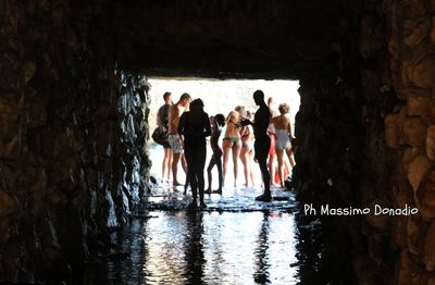 Group of people standing in water