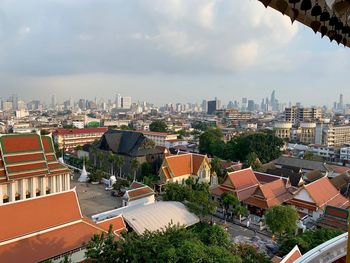 High angle view of buildings in city against sky