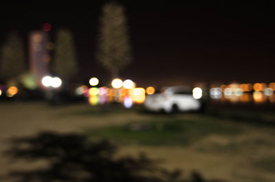 Defocused image of illuminated street lights at night