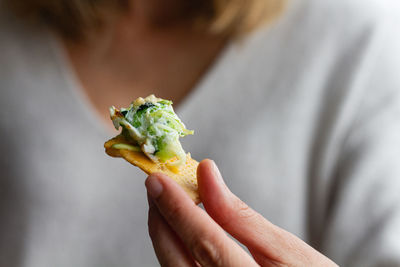 Close-up of hand holding food