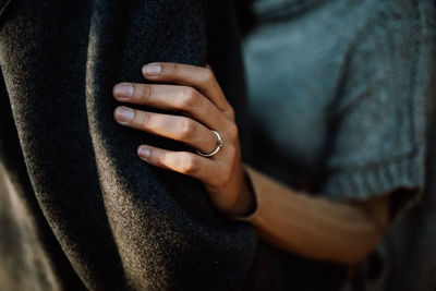 Midsection of man wearing sweater