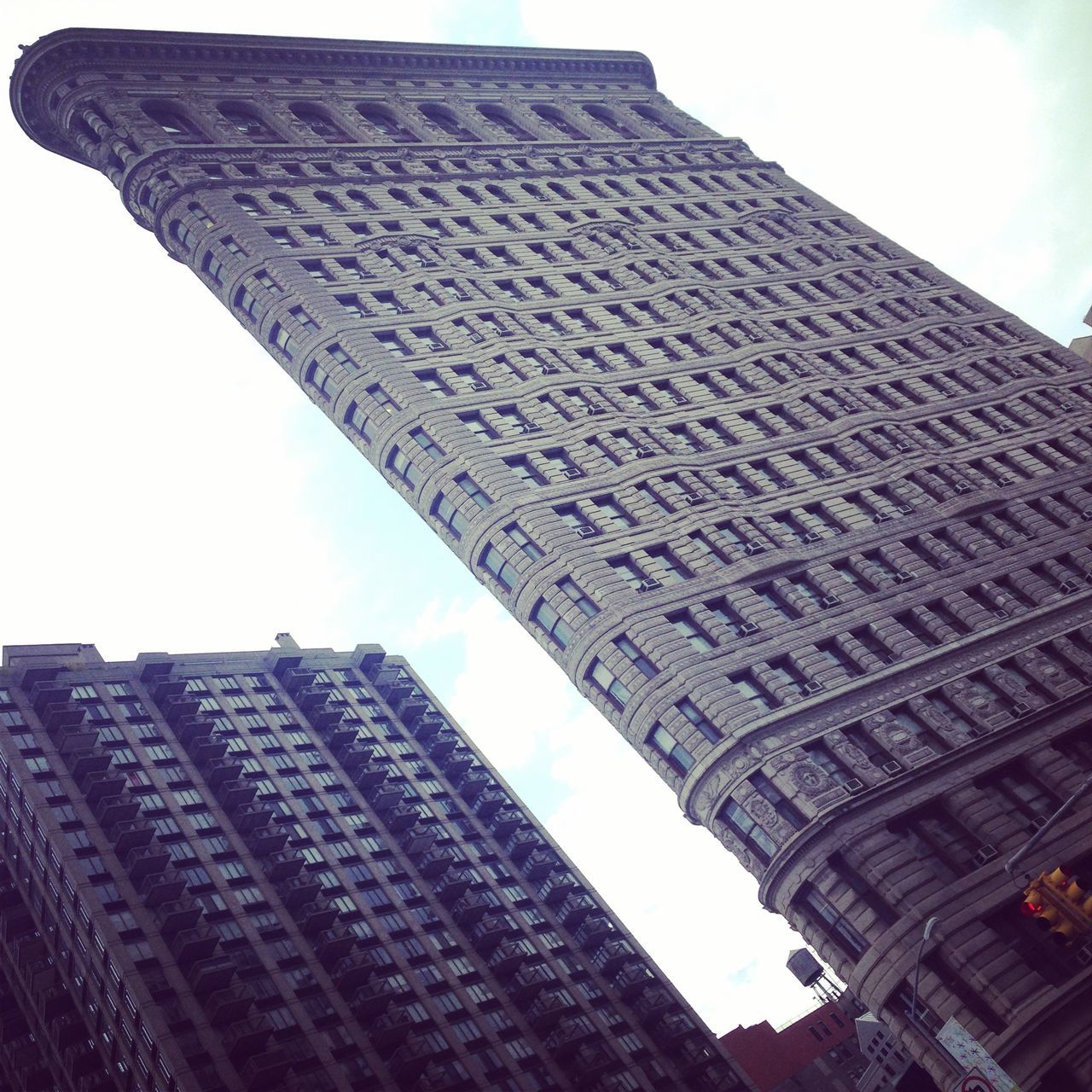 LOW ANGLE VIEW OF SKYSCRAPERS AGAINST SKY