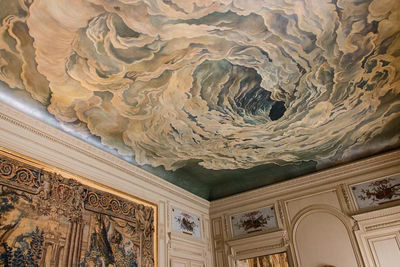 Low angle view of ornate ceiling in building