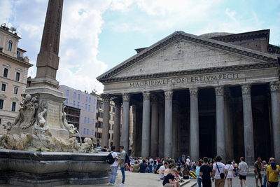 Group of people in front of historical building