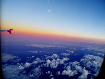 Aerial view of cloudscape over sea at sunset
