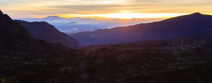 Scenic view of mountains against sky during sunset