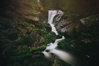 Stream flowing through rocks