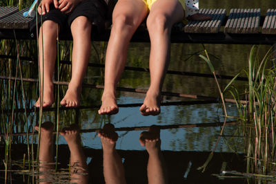 Low section of woman in water