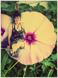 Close-up of young woman with flowers