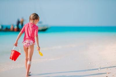 Rear view of woman on beach