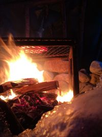 Close-up of fire burning at night