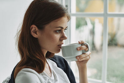 Close-up of woman drinking coffee