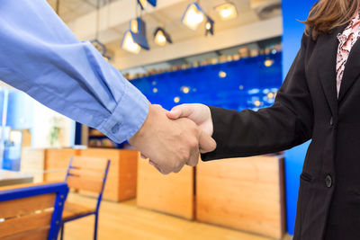 Cropped image of people shaking hands