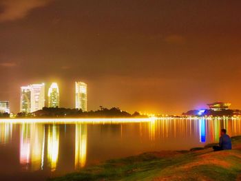 Reflection of illuminated buildings in water