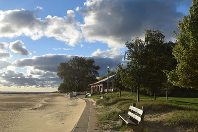 Empty road against cloudy sky