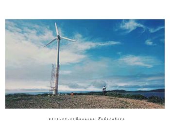 Scenic view of rural landscape against blue sky