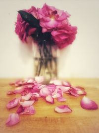 Close-up of pink roses on table