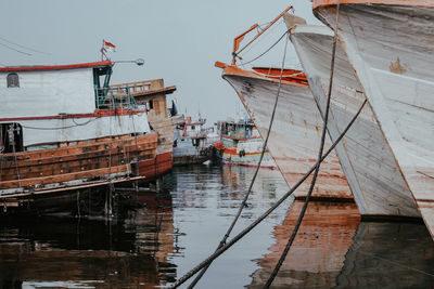 Ships anchored in the port of muara baru at noon after sailing in the ocean to catch fish