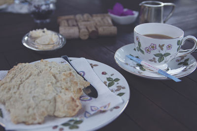 Coffee cup and saucer on table