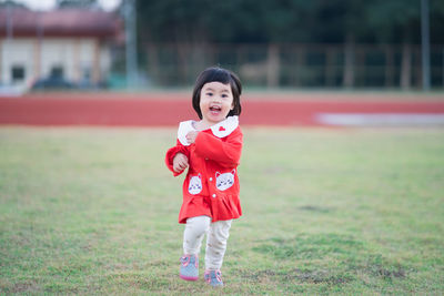 Portrait of cute girl playing at park