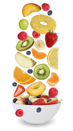Various fruits in plate against white background