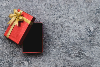 Red umbrella on box against white background