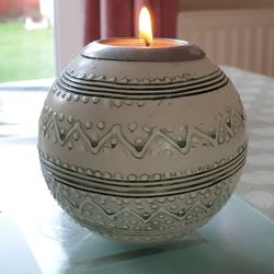 Close-up of illuminated candles on table