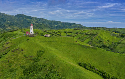 Scenic view of landscape and mountains against sky