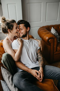 Young couple sitting on sofa