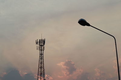 Low angle view of communications tower against sky