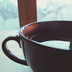 Close-up of coffee cup on table