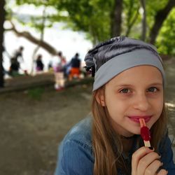 Portrait of girl eating popsicle