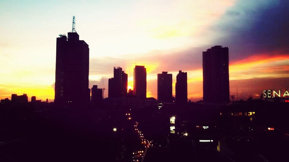 sunset, architecture, building exterior, built structure, city, skyscraper, silhouette, orange color, sky, tower, tall - high, urban skyline, cityscape, modern, cloud - sky, office building, skyline, city life, dramatic sky, travel destinations