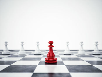 Close-up of chess pieces against white background