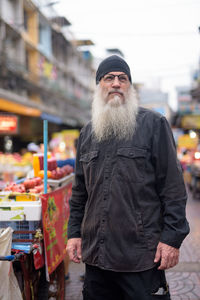 Man standing at market in city
