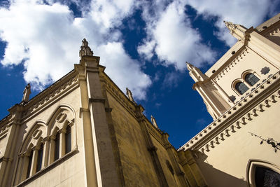 Low angle view of bell tower against sky