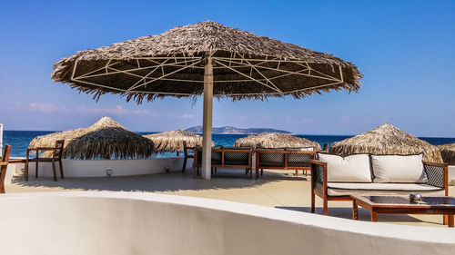 Built structure on beach against clear blue sky