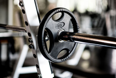 Close-up of barbell in gym